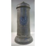 A late 17th/early 18thC pewter flagon of tapered cylindrical form with an engraved armorial shield,