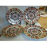 A set of six Royal Crown Derby bone china dinner plates, decorated in the Imari palette 10.