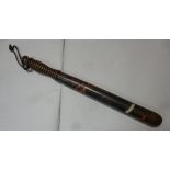 A late 19thC police wooden truncheon, bears remnants of red and black paint, impressed PC79,