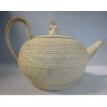 A late 18th/early 19thC Wedgwood moulded basketweave and biscuit glazed earthenware teapot of squat