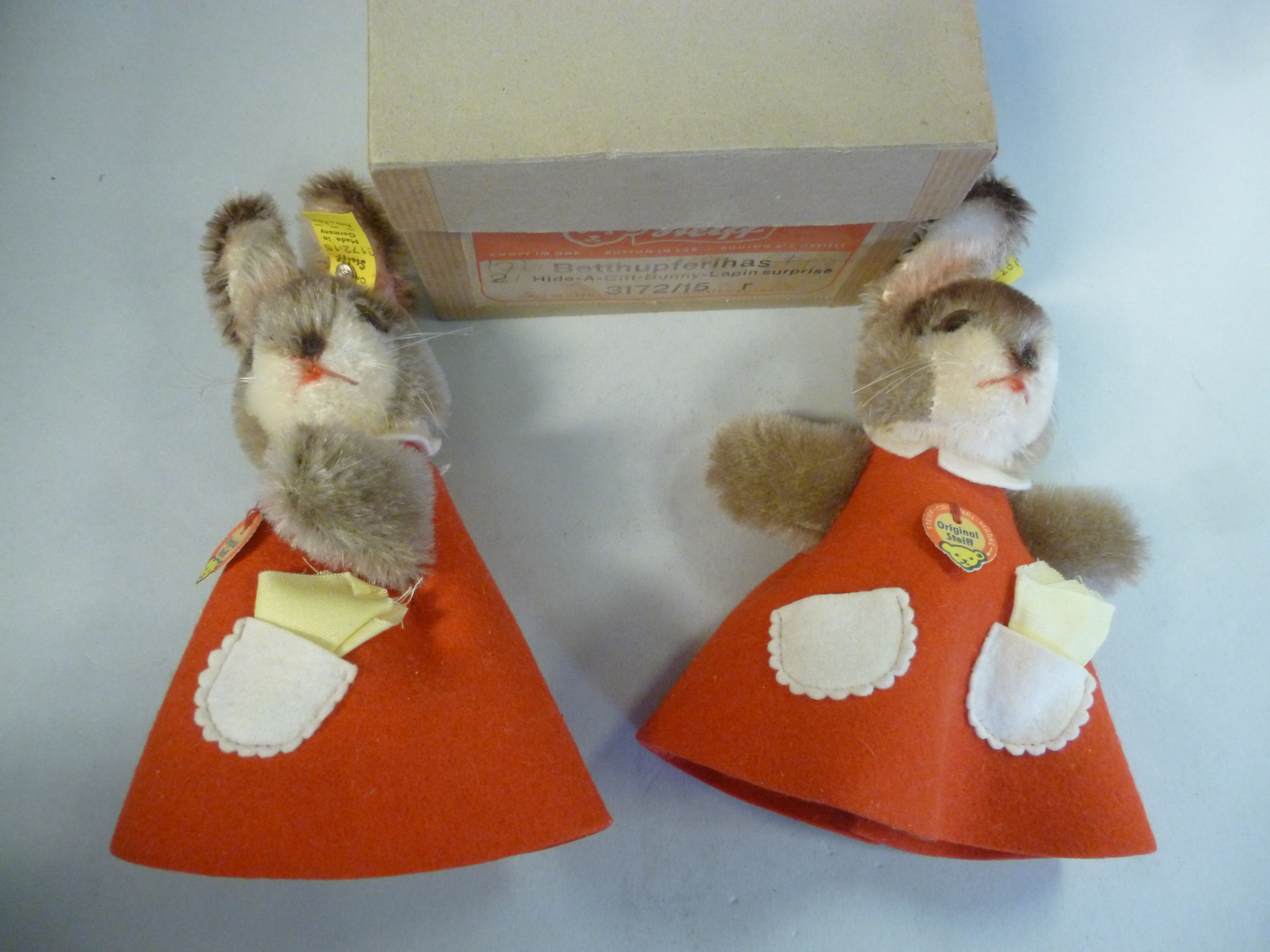 A pair of Steiff 'Hide a Gift Bunny-Lapin Surprise' red rabbits 6''h boxed