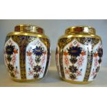 A pair of Royal Crown Derby bone china ginger jars and covers,