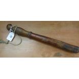 A late 19thC unpainted wooden police truncheon, on a ribbed, eliptically turned handgrip 14.