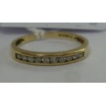 A 9ct gold diamond set half eternity ring 11