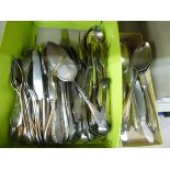 A canteen of German silver plated flatware with decoratively scrolled ornament on the handles