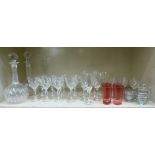 Glassware: to include a pair of bulbous decanters; a set of twelve facet cut,