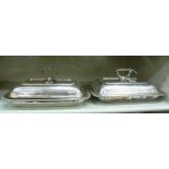 A pair of silver plated rectangular entree dishes with gadrooned borders,