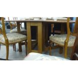 A modern teak finished Sutherland style dining table,