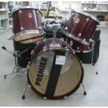 A five piece Premier drum kit: to include a bass drum with a carrying case;