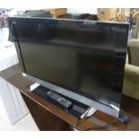 A Sony Bravia 30'' flatscreen TV with remote control BSR