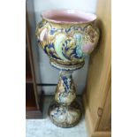 A late Victorian Lockwood & Co majolica jardiniere and stand,