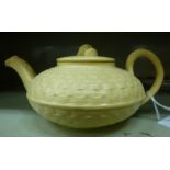 A late 18th/early 19thC Wedgwood moulded basketweave and cream coloured glazed earthenware teapot