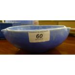 A CH Brannan sponged powder blue pottery bowl with a triple dimpled border bears an impressed mark