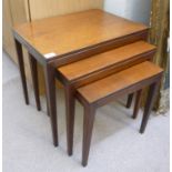 A nesting set of 1970s teak occasional tables, the rectangular tops raised on square,