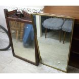 Five 20thC mirrors: to include an Edwardian mahogany example with a broken swan neck pediment,