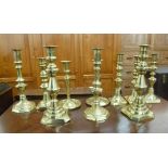 Five similar pairs of 19thC brass candlesticks with variously knopped stems,