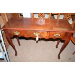 A reproduction mahogany side table, fitted three frieze drawers, raised on cabriole legs.