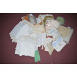 A quantity of good quality table linen; lace doilies; tea cosies; etc., in a box.