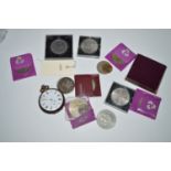 A George IV silver crown, 1821; a gunmetal cased striking pocket watch; together with other coins.