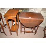 An oak drop leaf occasional table with barley twist legs;