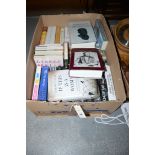 A box of hardback novels.