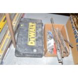 A Dewalt electric hammer drill in fitted case; and a box containing various hammer drills; chisels;