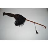 A Victorian black silk parasol, with folding turned stained wood handle, and bone finial.