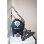 A Sebo Air Belt D2 Total 2100 watt vacuum with attachments.