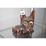 A composition novelty clock in the form of a terrier,