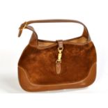 A Gucci brown suede and leather handbag, with yellow metal bolt clasp,