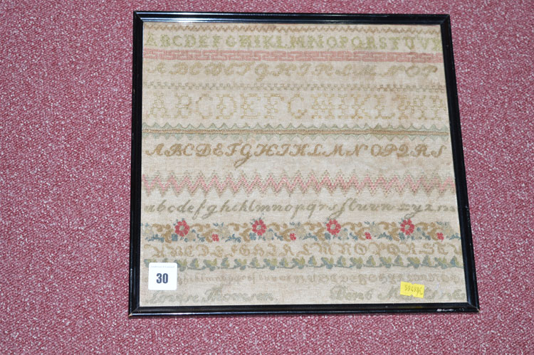 A 19th Century part silk sampler, with alphabet and foliate decoration, worked by Louise Thomsen,