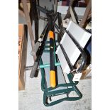 A pair of edging shears; a weeder; folding seat; etc.