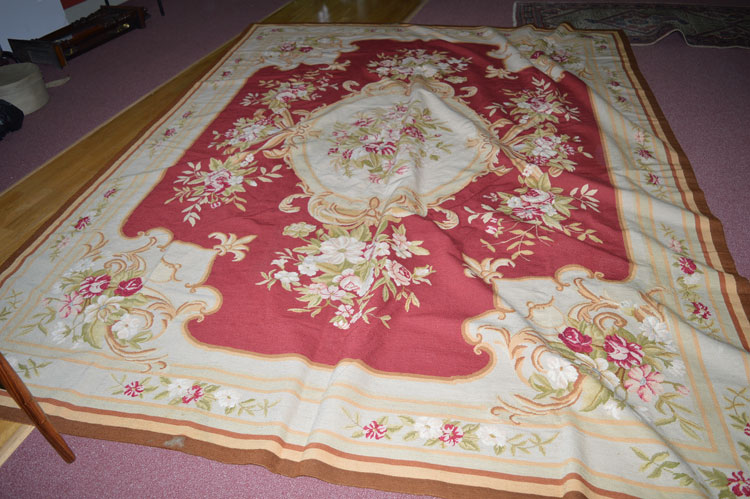 A 19th Century aubusson carpet/wall hanging, with rose and floral decoration to borders and centre,