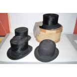 Two Battersby & Co. brushed silk top hats, inner rims 8 x 6 1/4in.