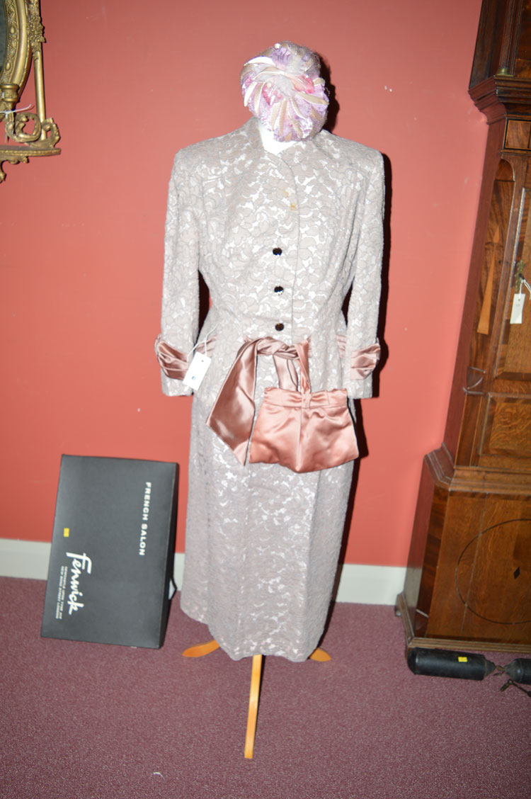 A 1950's pink taupe-lace two-piece suite, size 12 (approx), comprising jacket and skirt,