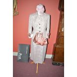 A 1950's pink taupe-lace two-piece suite, size 12 (approx), comprising jacket and skirt,