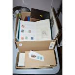 A box of stamp collections in albums and loose stamps, including first day covers.