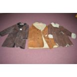 A Morlands brown sheepskin jacket; together with two others, one in tan, size 14/16 approx.