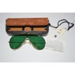 A pair of vintage Bausch & Lomb 'Wings' green tinted sunglasses, with detachable brow bar present,