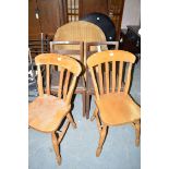 Three modern Windsor style dining chairs; and a pair of oak dining chairs.