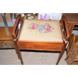 An Edwardian inlaid mahogany piano stool, the woolwork seat decorated with flowers,
