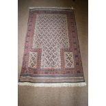 A Beluche prayer rug with stylized star designs and flat woven ends.
