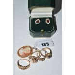 A pair of garnet and pearl cluster earrings; a cameo ring; three other rings;