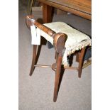 An early 20th Century mahogany piano stool,