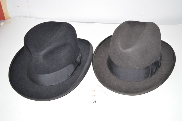 Two trilby hats, by Dunn & Co. Ltd., in black and dark grey, inner rim 8 x 6 1/2in. and 8 x 6 3/4in.