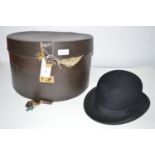 A Masters & Co felt bowler hat, inner rim 7 3/4 x 6 1/4in; and a hat box.