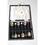 A set of six coloured bean finial silver coffee spoons, by Cooper Bros.