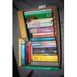 A box of books relating to Cricket.