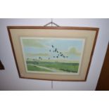 Colour prints - Geese flying over landscapes, after Peter Scott, signed in pencil to margin.