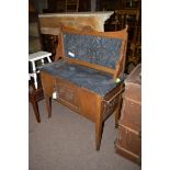 An early 20th Century oak wash stand with marble back and top.